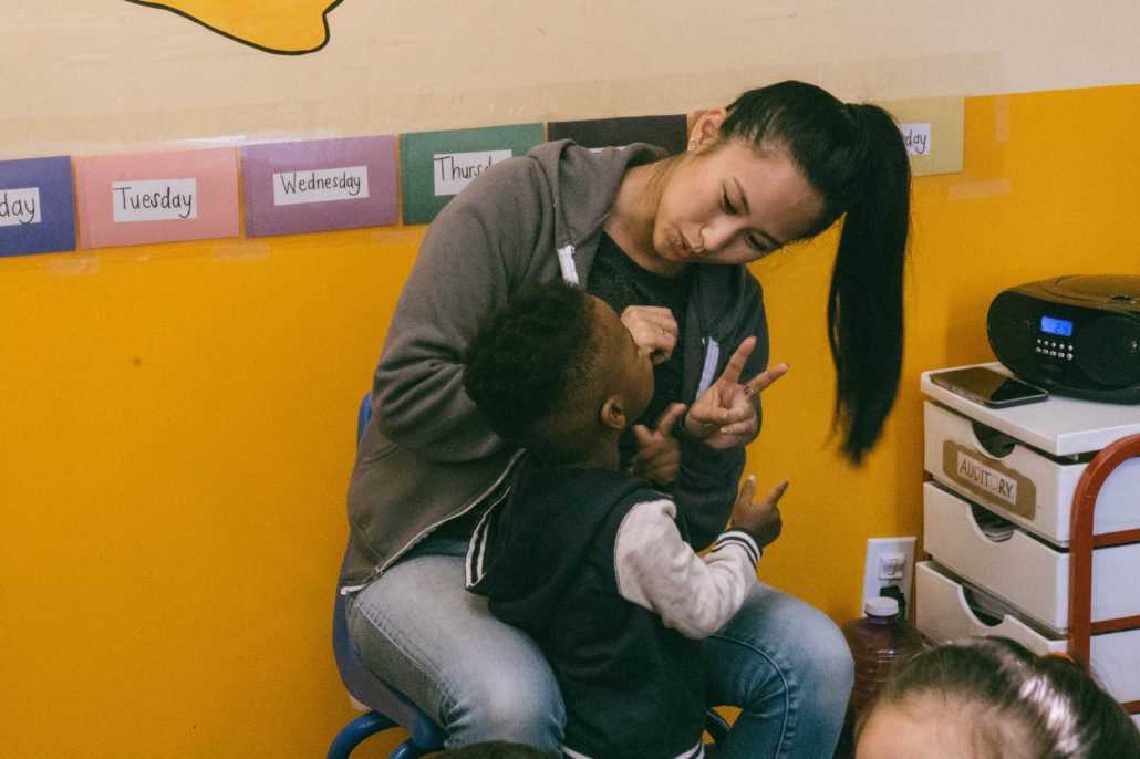 Adult interacting with a young child