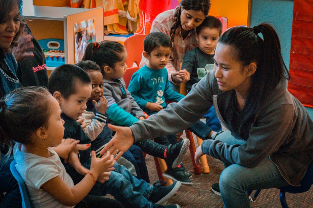 Children and adults during a group activity
