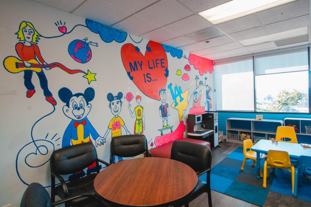 Children’s room with mural and tables